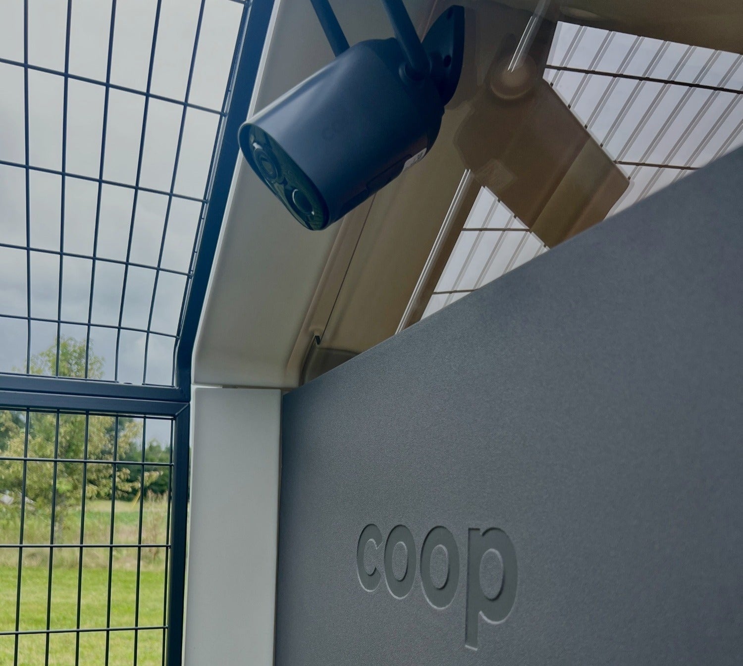 Smart CoopCam attached to a chicken coop, showcasing the security camera system by The Smart Coop for poultry safety.