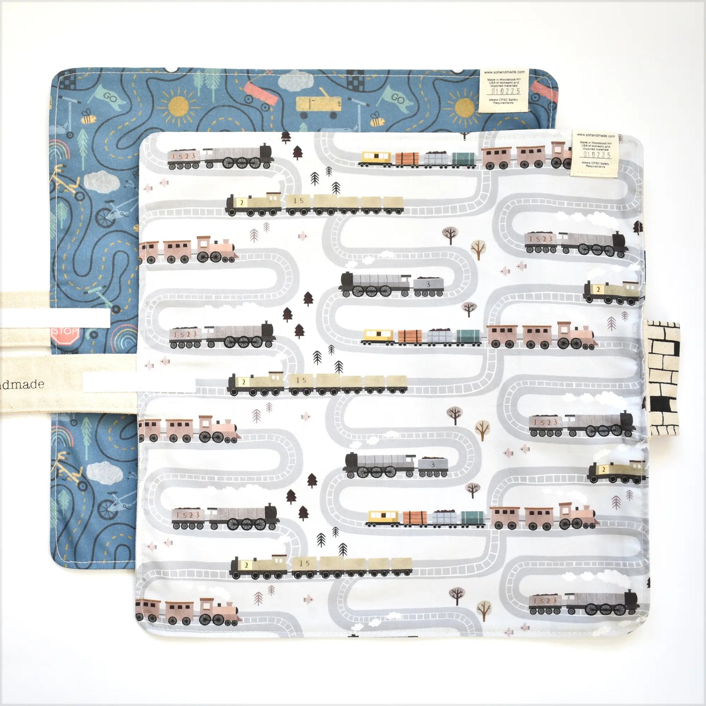 Colorful train playmat for toddlers by So Handmade Shop featuring portable train tracks for travel fun and early learning.
