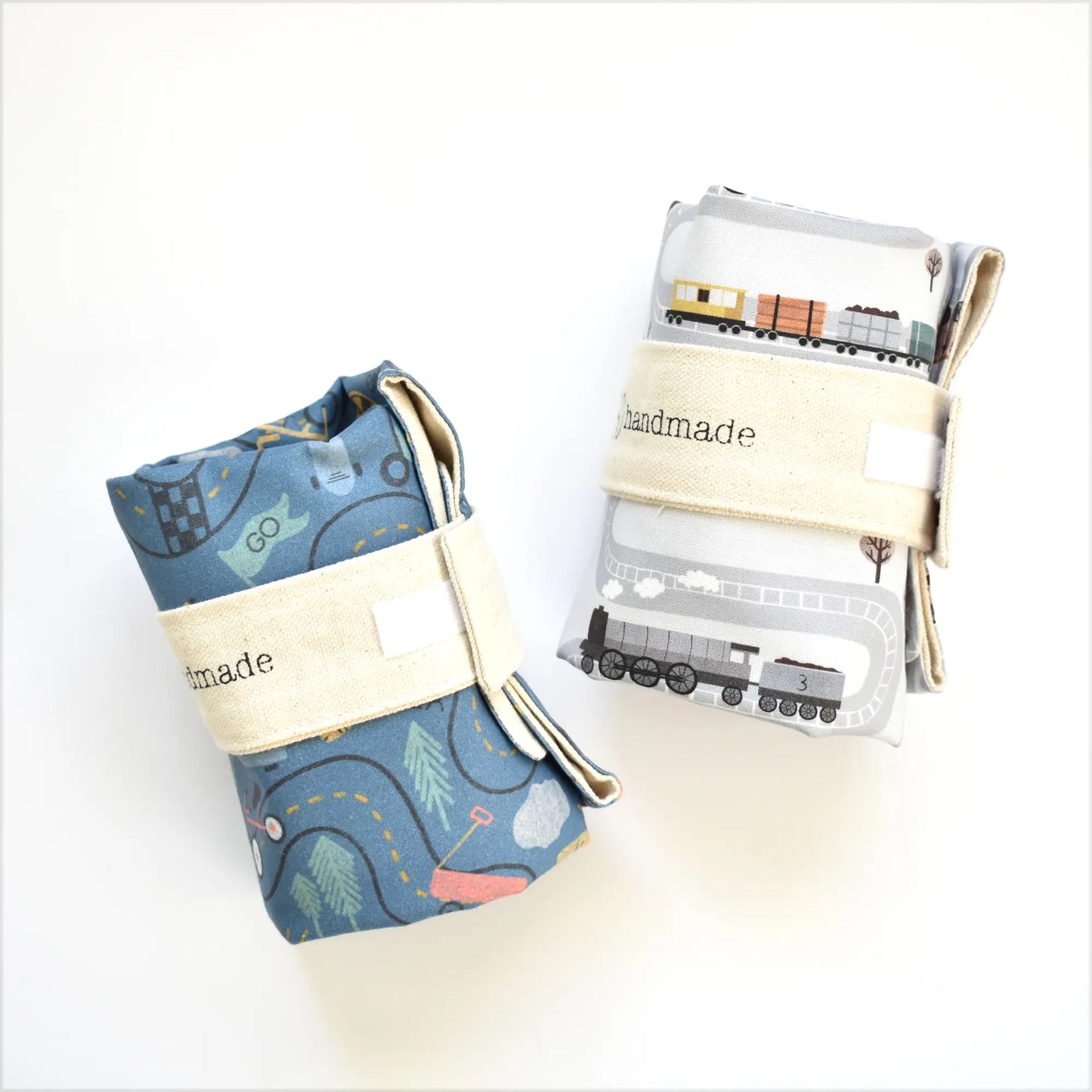 Colorful train-themed toddler playmat by So Handmade Shop with portable tracks, ideal for travel and imaginative play.
