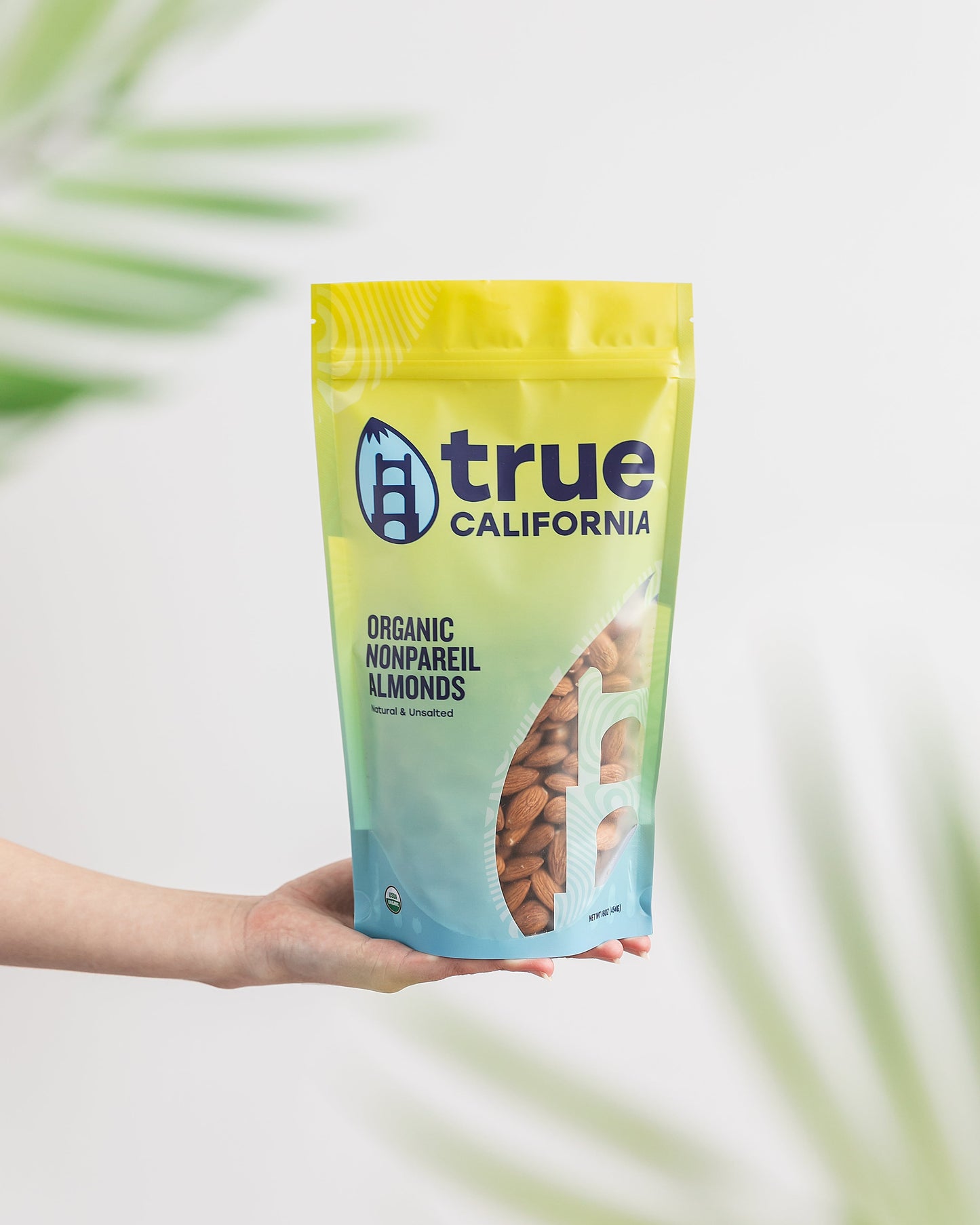 True California Organic Nonpareil Almonds in a 1 lb bag, showing fresh, whole almonds with smooth, light-colored shells.
