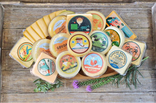 Assorted Wisconsin cheeses from Cheese Brothers, Inc. in a gift bundle with cheese varieties and packaging, ideal for gifting.