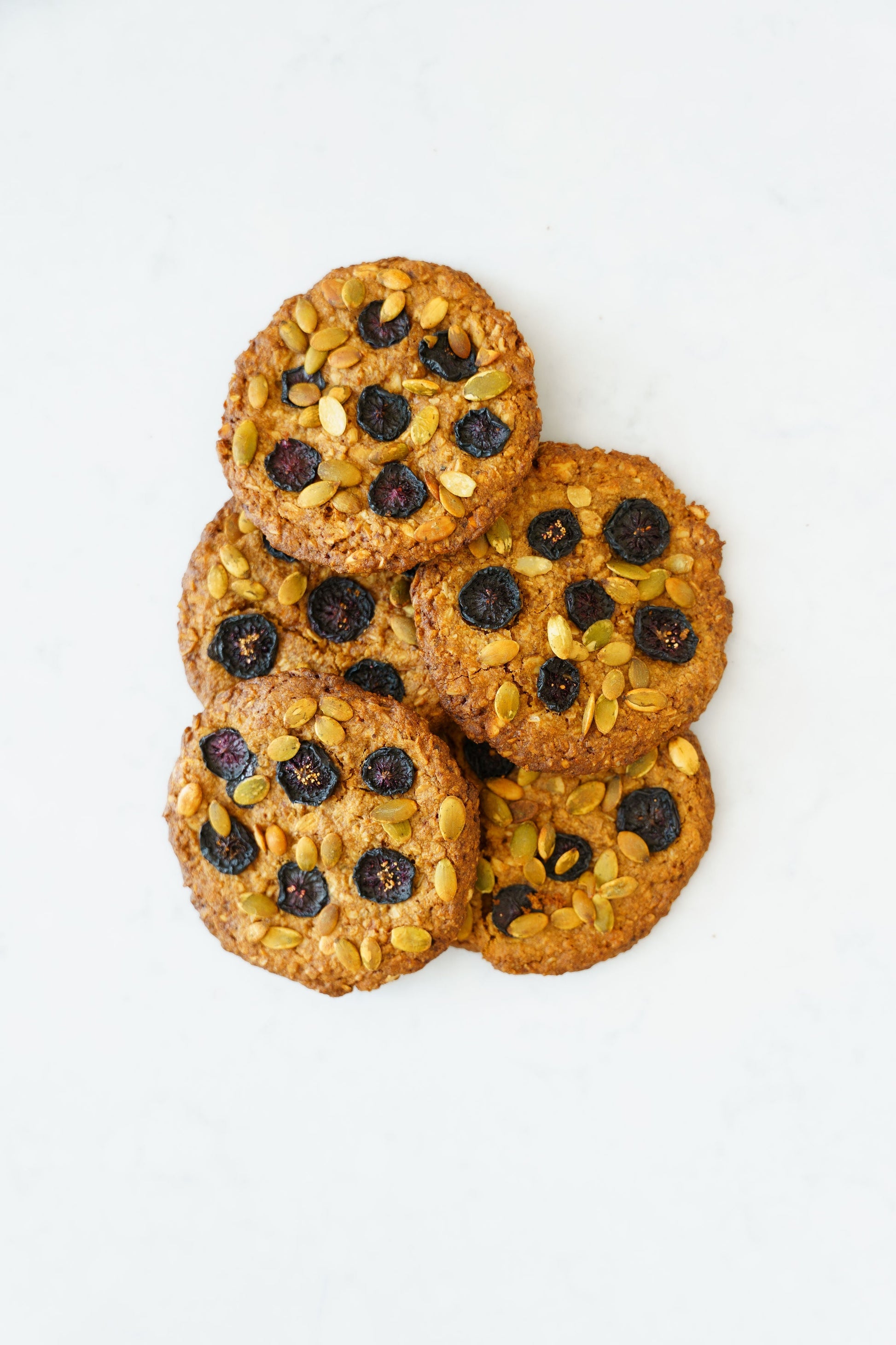 Gluten-free vegan oat-cherry cookies from Heaven Gluten Free Bakery, three-pack, showing golden-brown pastries with cherry pieces.