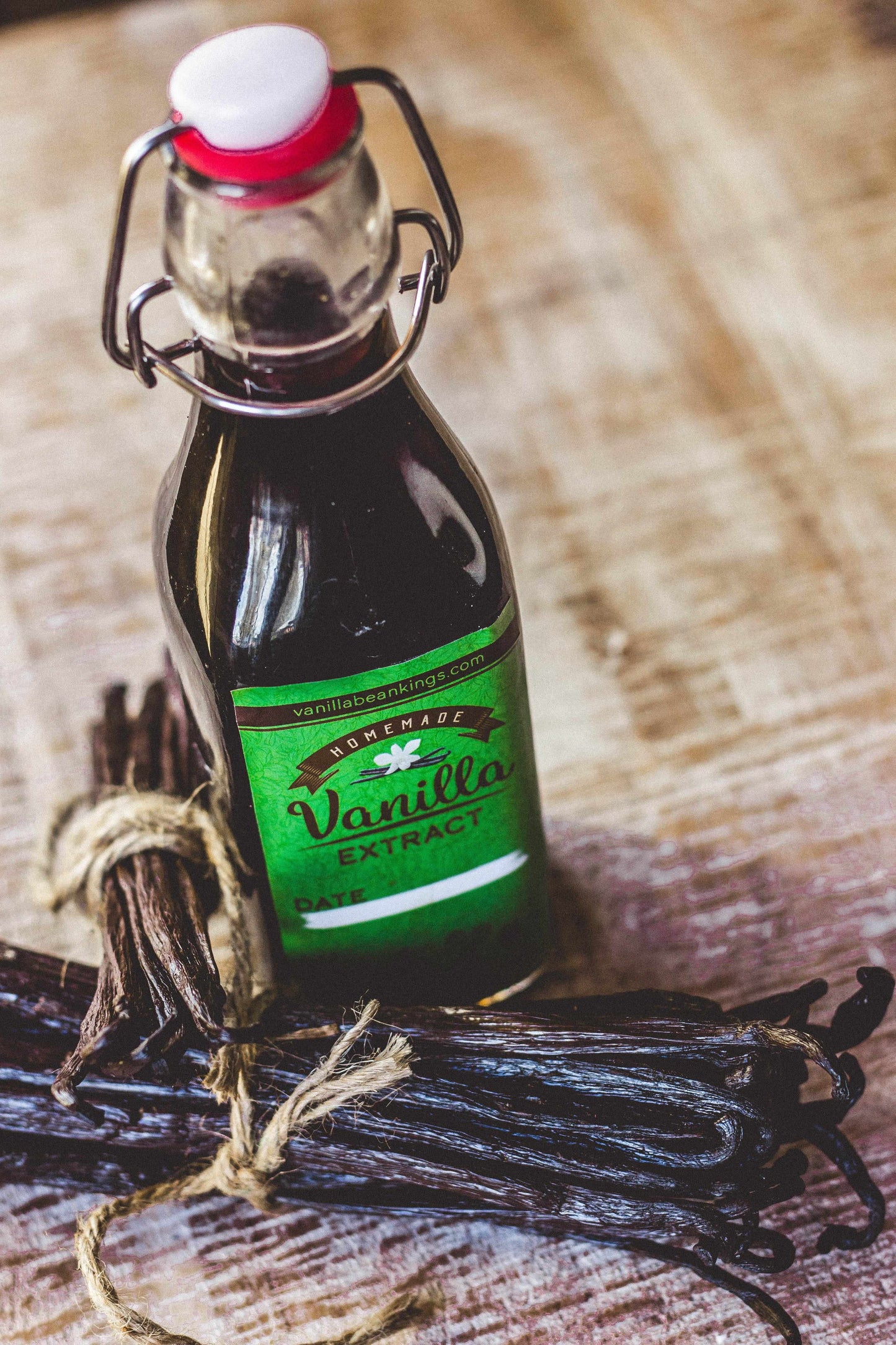 Vanilla Bean Kings homemade vanilla extract kit with organic Madagascar vanilla beans and glass jar for flavor infusion.