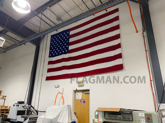 WallSafe™ polyester American flag with reinforced edge grommets, wall-mounted design, made in the USA by Flagman of America.