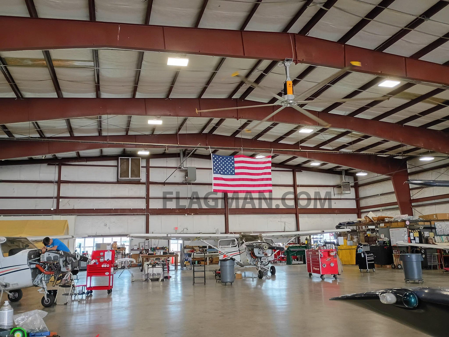Nylon American flag WallSafe™ wall-mounted flag with reinforced edge grommets, made in the USA, displayed on a wall.