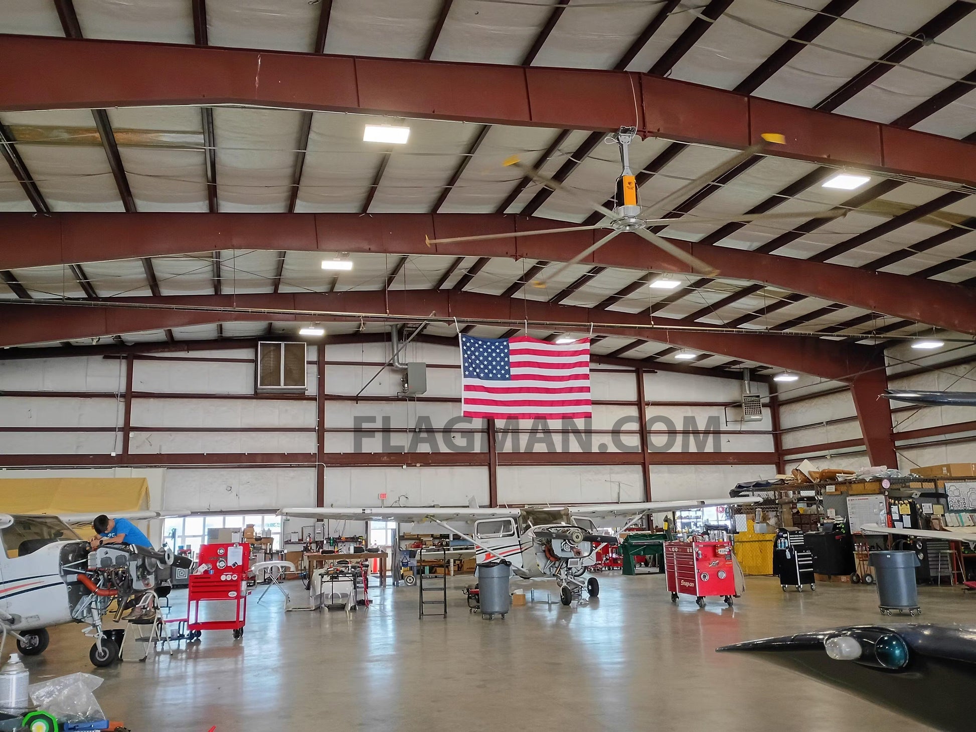 Nylon American flag WallSafe™ wall-mounted flag with reinforced edge grommets, made in the USA, displayed on a wall.