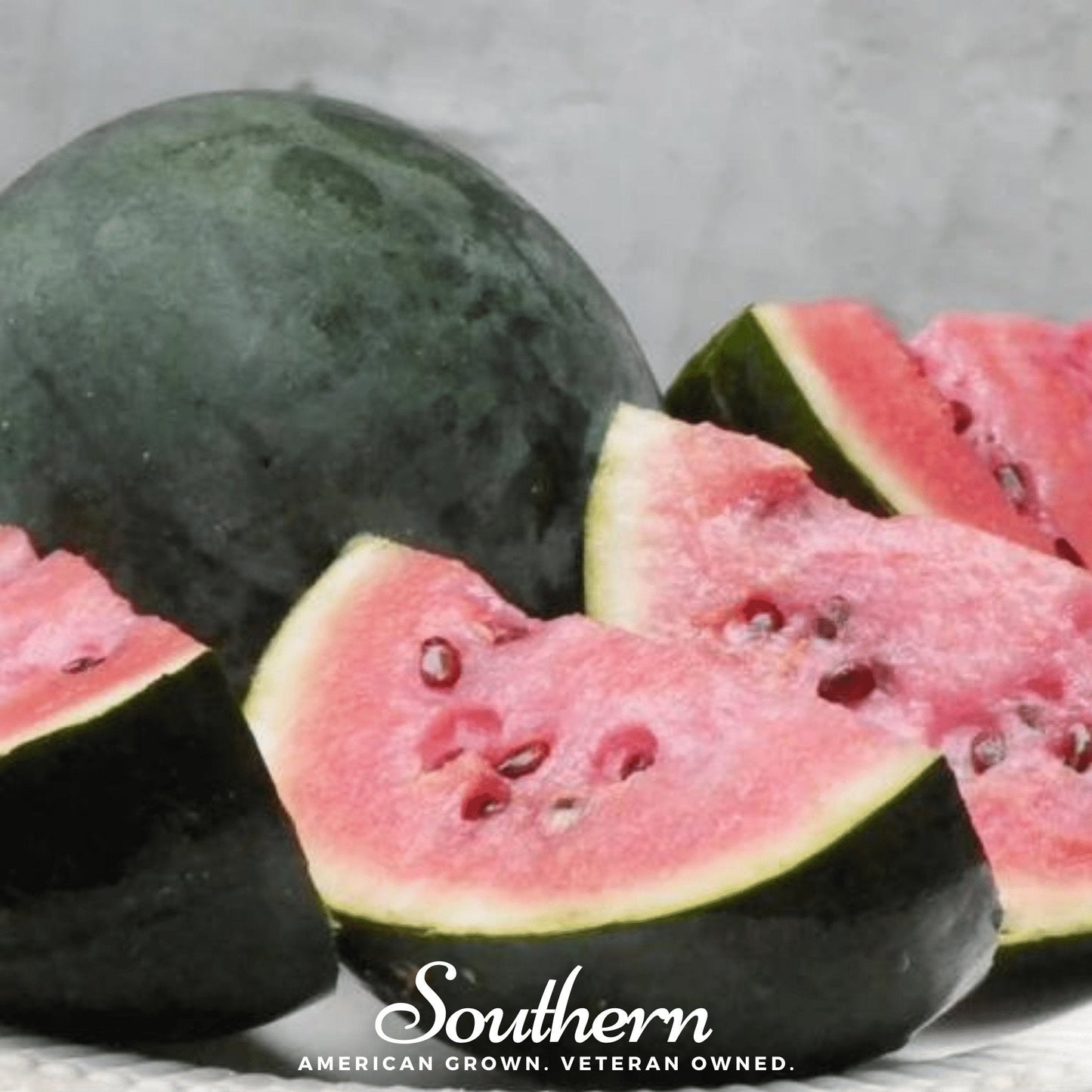 Sugar Baby Watermelon seeds by Southern Seeds, showing 25 seeds on a white background.