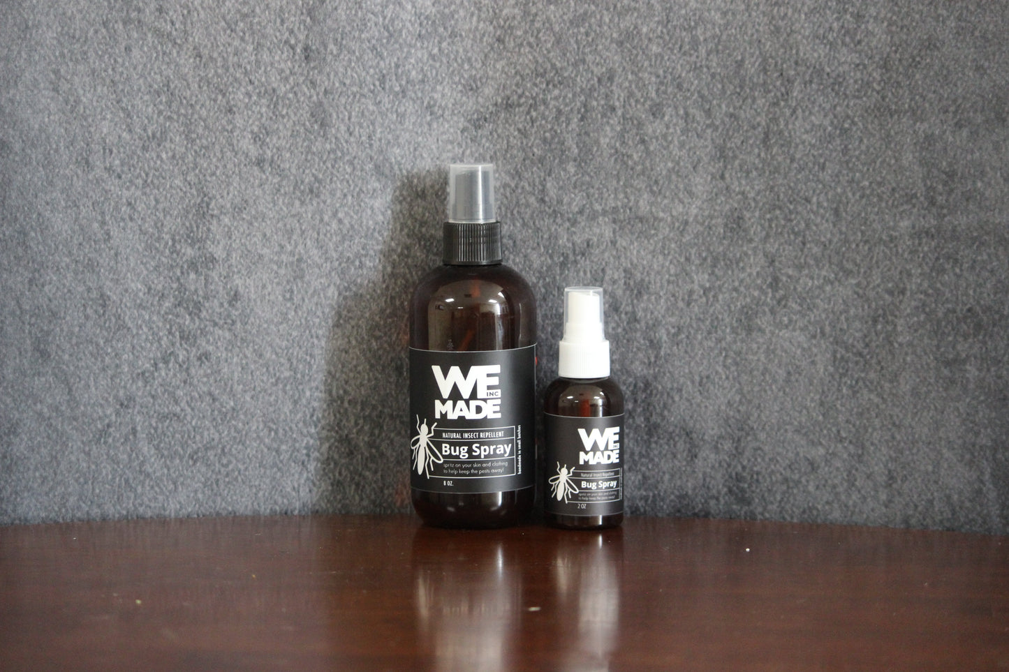 We Made 2 oz. bottle of bug spray with a spray nozzle, designed to repel insects effectively.