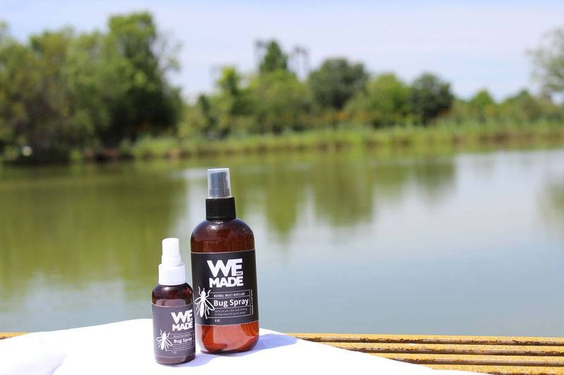 Natural insect repellent bug spray by WE Made, featuring a spray bottle with botanical ingredients for outdoor insect protection.