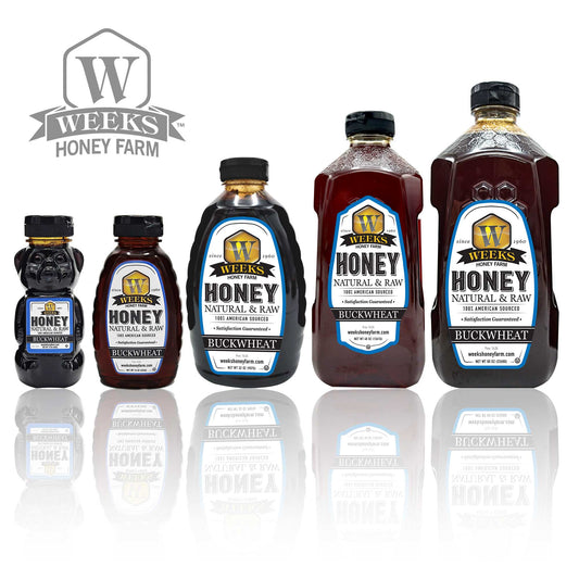 Five bottles of Weeks Honey Farm Raw Buckwheat Honey—pure, all-natural, antioxidant-rich with a dark, robust molasses flavor—are displayed in various sizes with white labels and black caps. The Weeks Honey Farm logo is in the upper left corner.