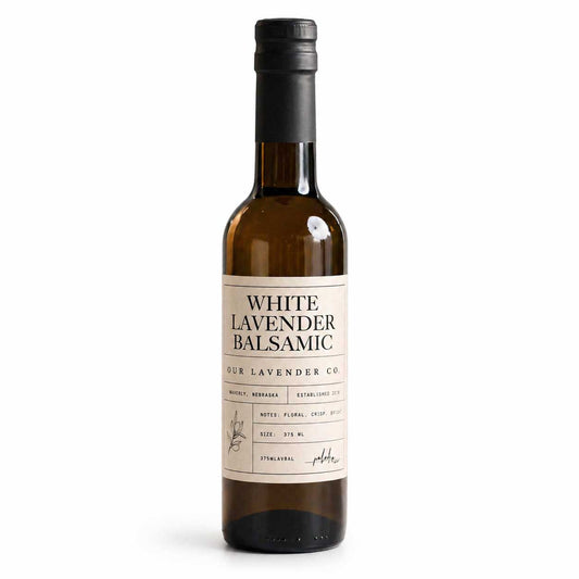 White Lavender Balsamic Vinegar bottle from Our Lavender Co, 12.7 oz, showcasing a clear glass bottle with a white label.