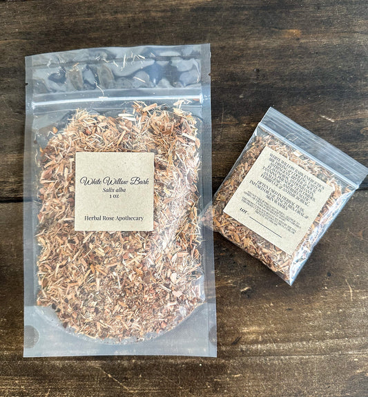 Dried white willow bark herbs in a bowl, natural herbal remedy from HerbalRoseApothecary, showing white bark pieces on a neutral background.