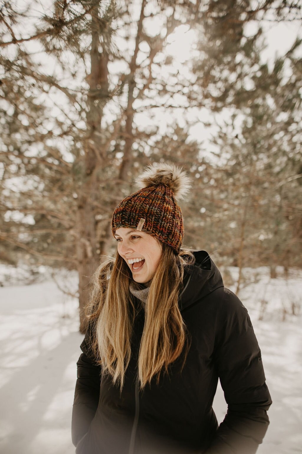 Brown multi-color Merino Wool Ribbed Knit Hat with faux fur pom-pom by Woolly Bear Knits, featuring a cozy, textured design.