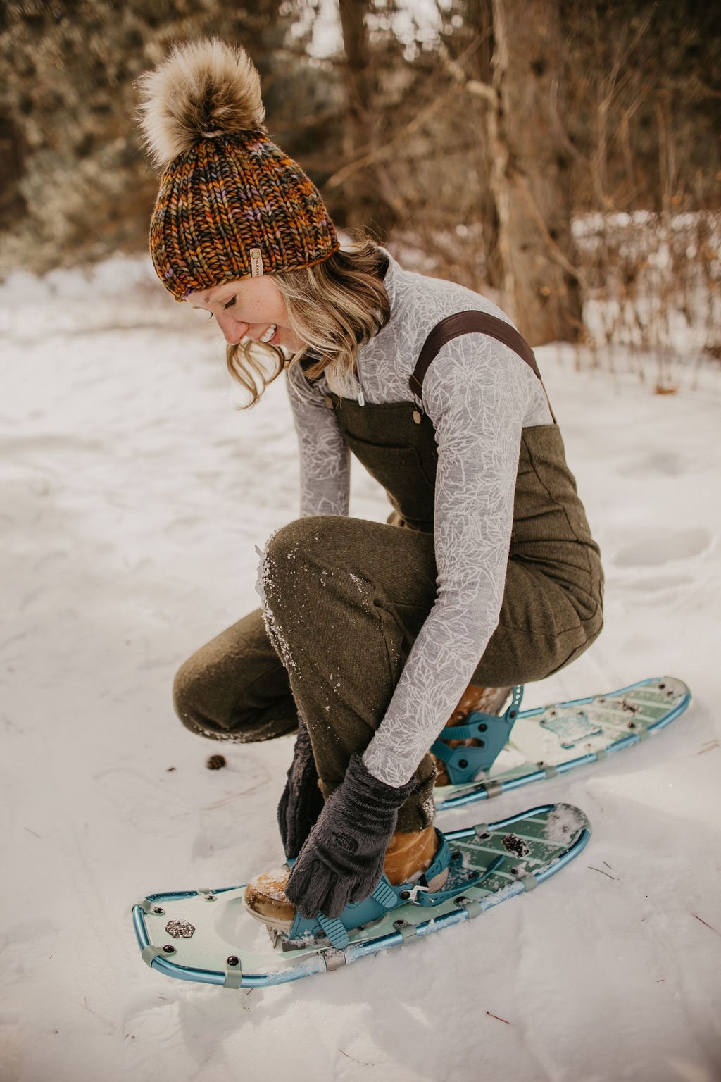 Brown multi-color merino wool knit hat with ribbed texture and faux fur pom pom by Woolly Bear Knits.