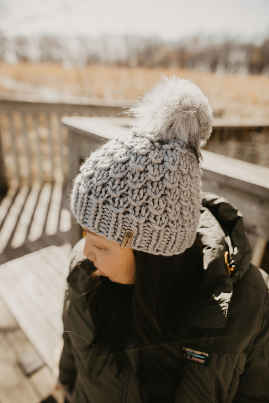 Gray Merino Wool Knit Hat with faux fur pom pom from Woolly Bear Knits, featuring a cozy, soft texture and stylish design.