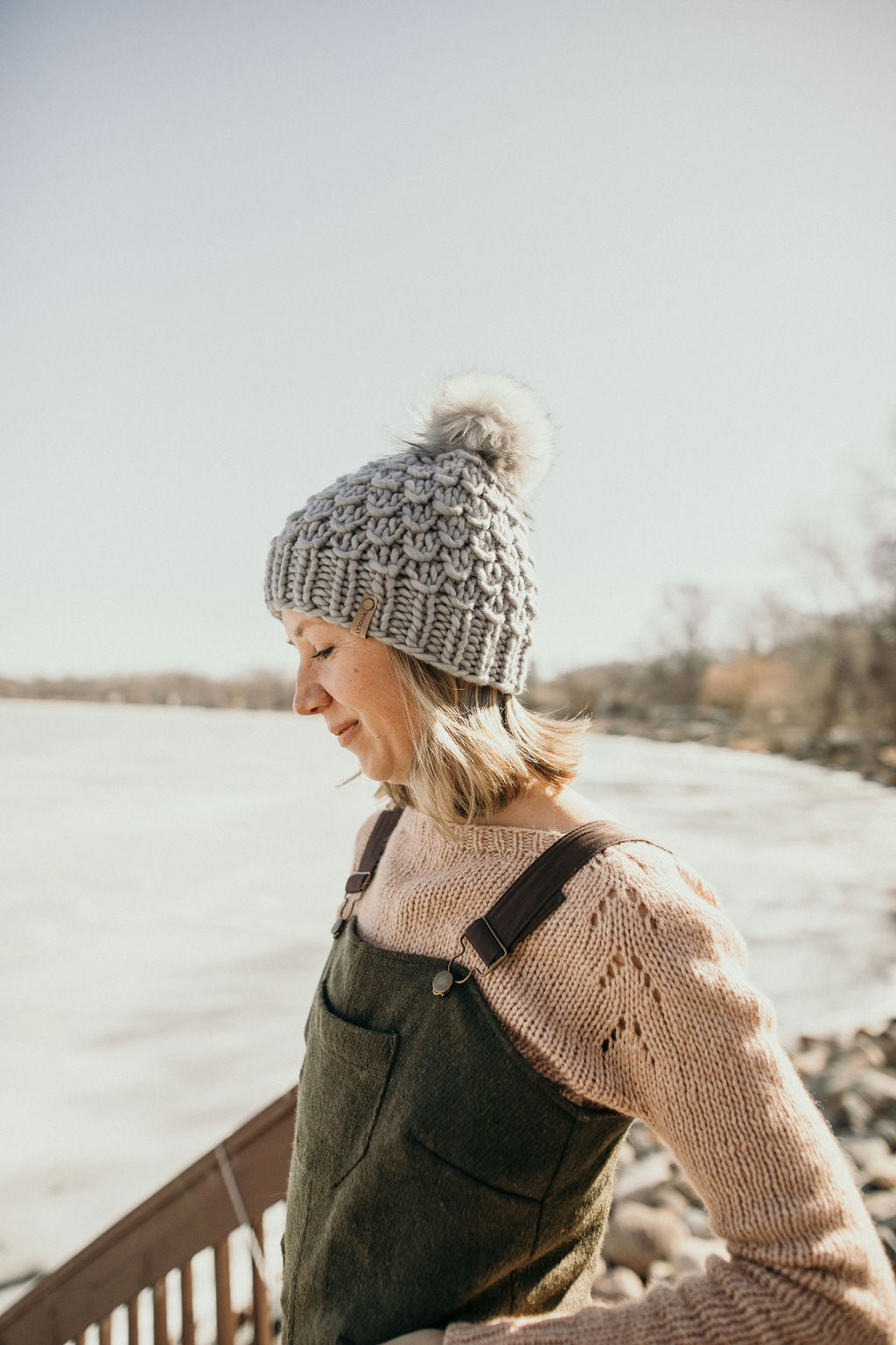 Gray Merino Wool Knit Hat with faux fur pom pom by Woolly Bear Knits, featuring warm, cozy merino wool and stylish faux fur pom.