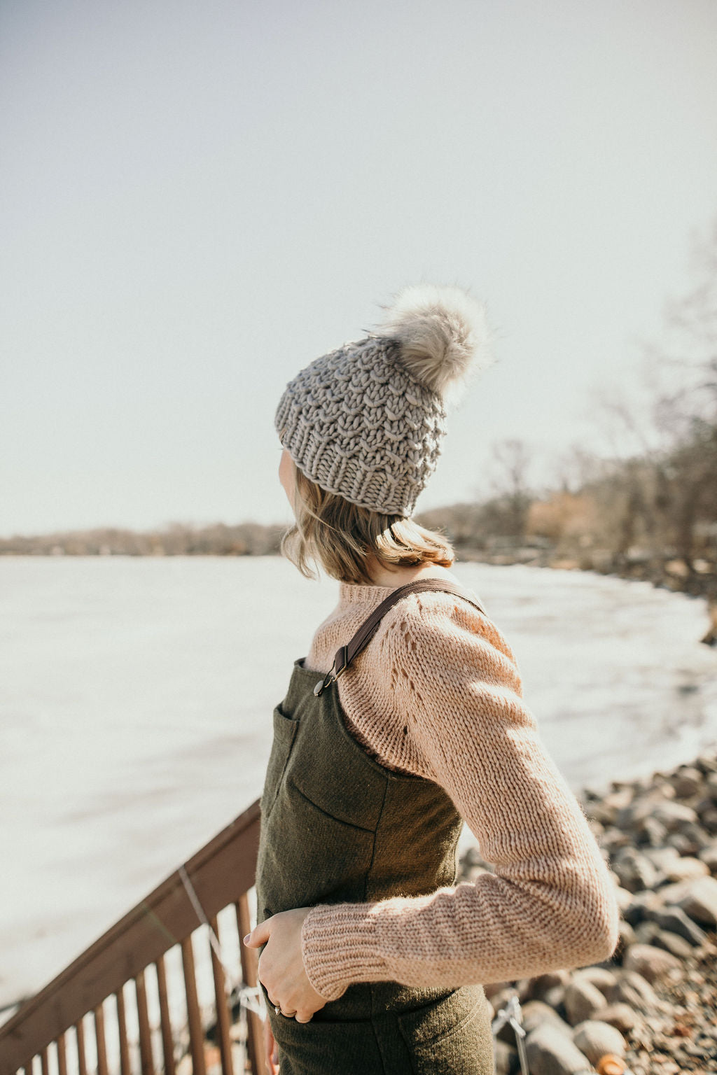 Gray Merino Wool Knit Hat with Faux Fur Pom Pom by Woolly Bear Knits, featuring a cozy wool hat with a fluffy pom for warmth and style.