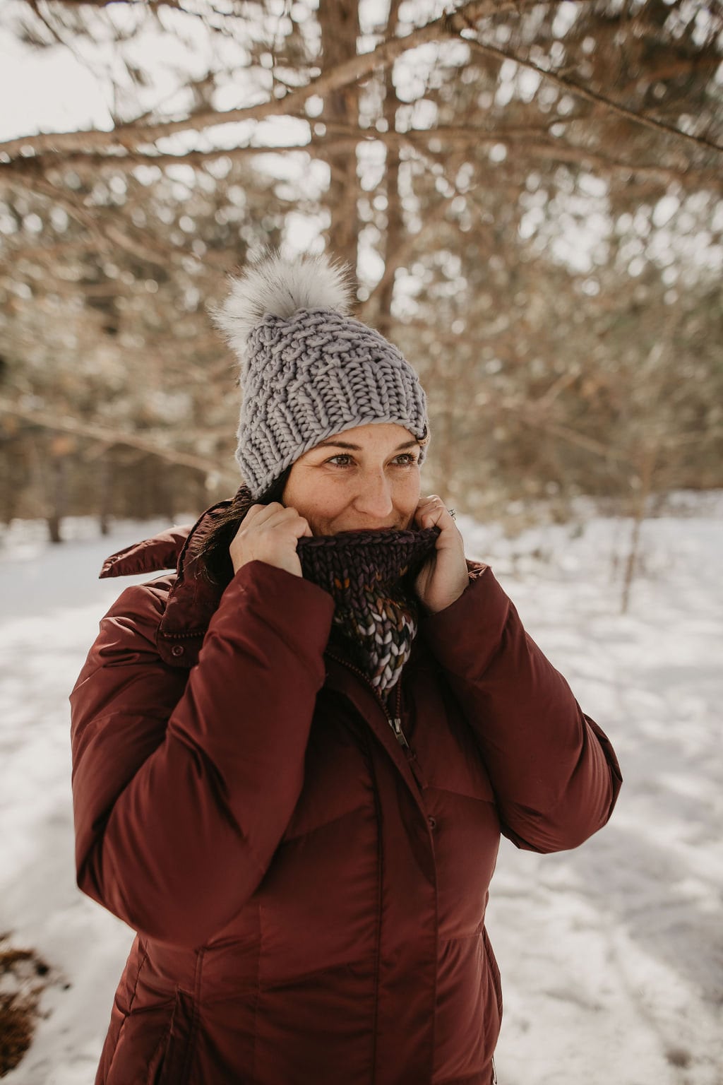Gray Merino Wool Knit Hat with faux fur pom pom from Woolly Bear Knits, featuring a cozy, textured knit design.