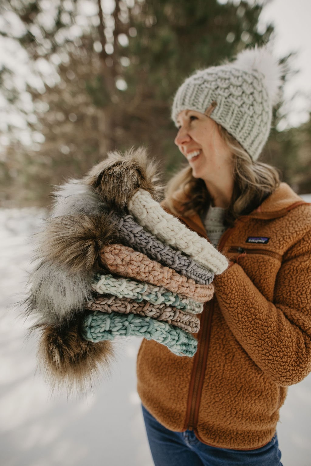 Gray Merino Wool Knit Hat with Faux Fur Pom Pom by Woolly Bear Knits, featuring a cozy wool cap with a fluffy pom for warmth and style.