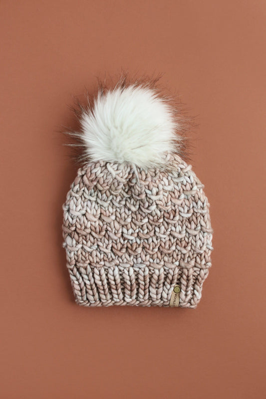 Pearl gray Woolly Bear Knits merino wool knit hat with a faux fur pom pom, soft and warm winter accessory.