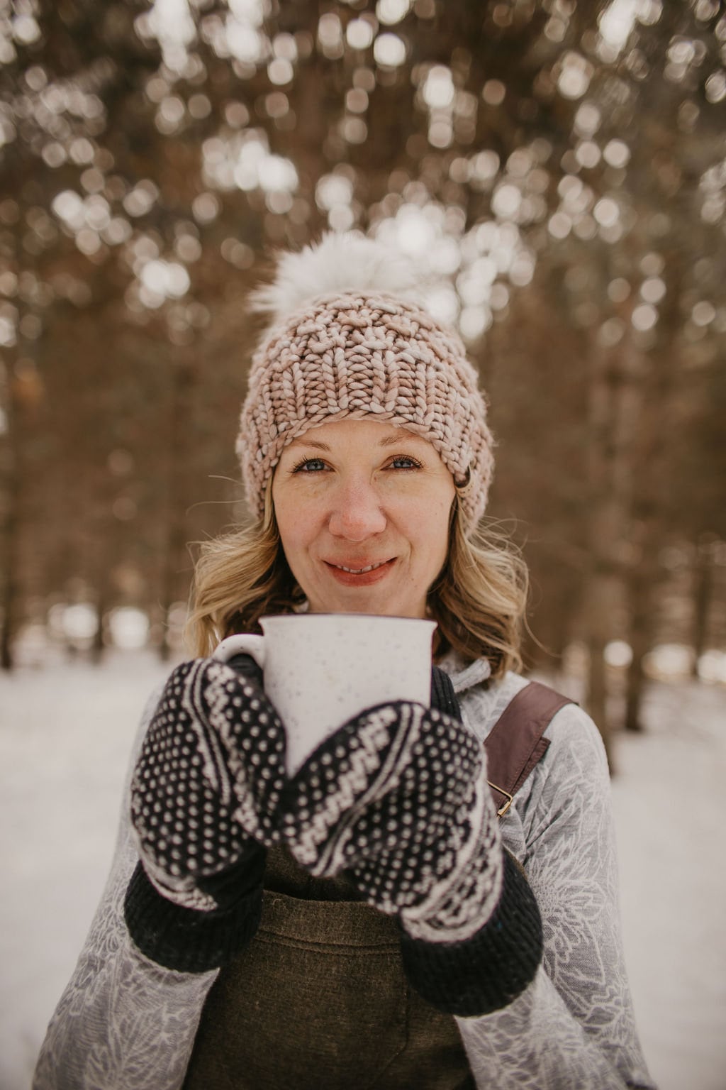 Pearl gray merino wool knit hat with faux fur pom pom from Woolly Bear Knits, cozy winter accessory.