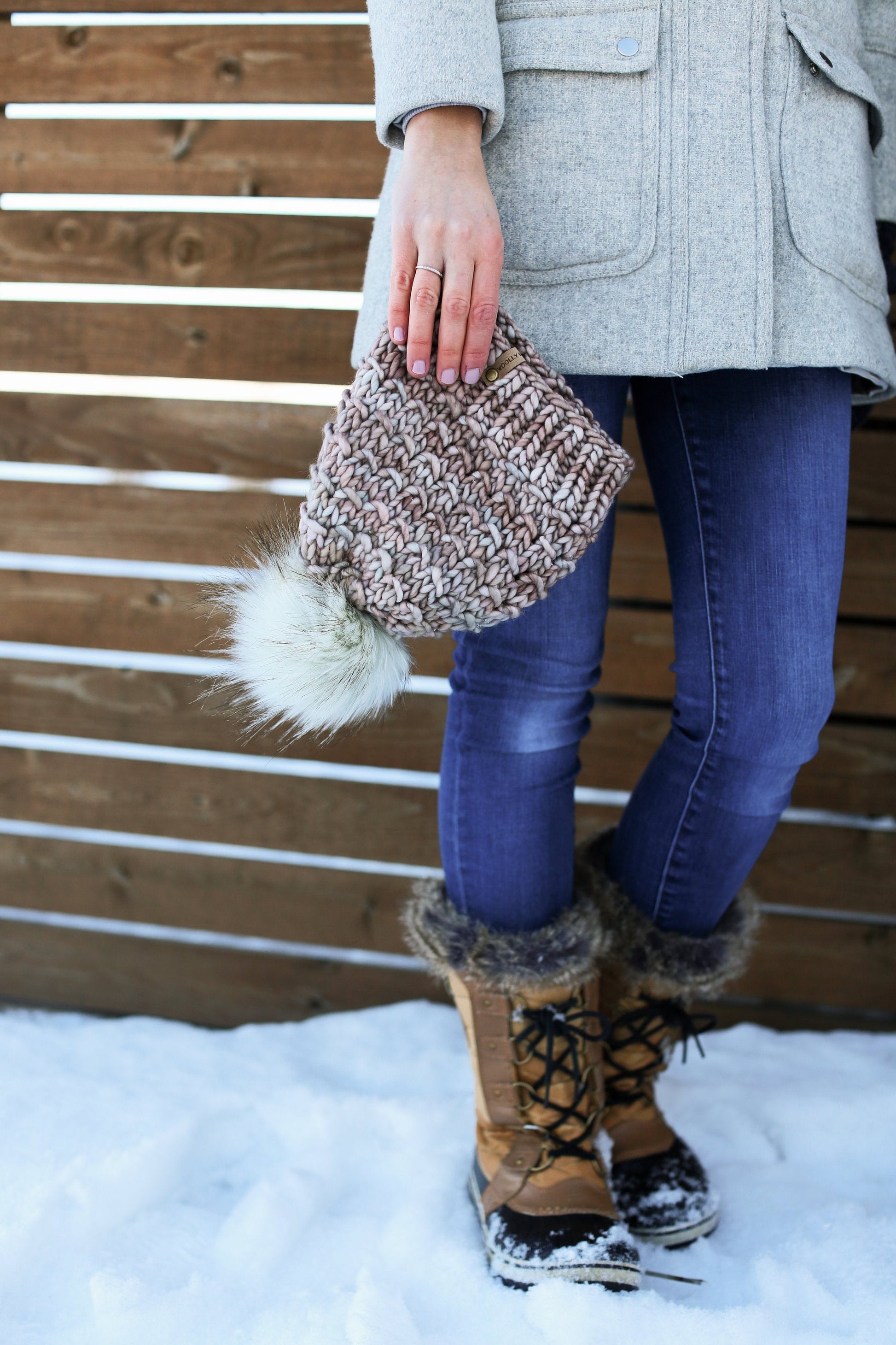 Pearl gray merino wool knit hat with faux fur pom pom from Woolly Bear Knits, cozy and stylish winter accessory.