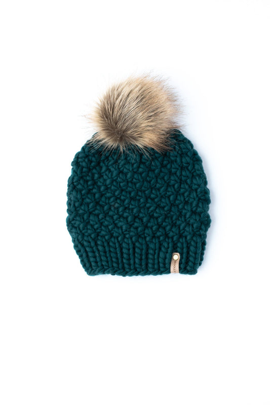 Forest green Peruvian wool knit hat by Woolly Bear Knits with a cozy faux fur pom-pom on top.
