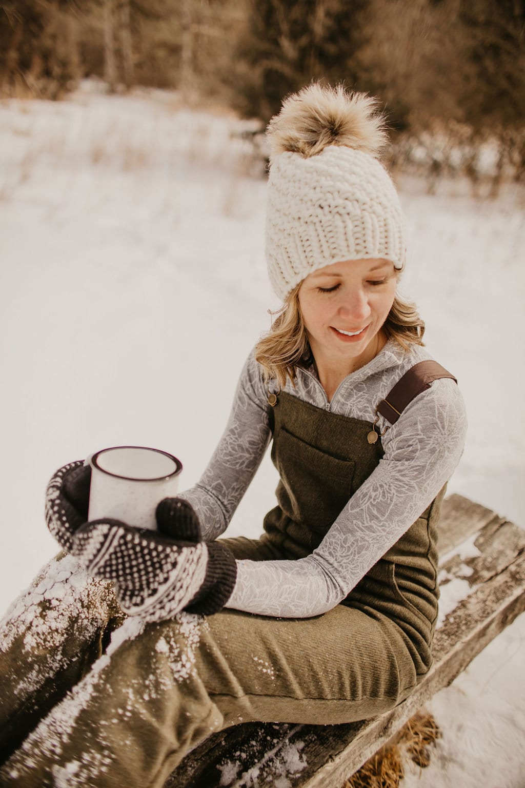 Ivory Peruvian wool knit hat with faux fur pom pom by Woolly Bear Knits, featuring cozy textured wool and fluffy pom detail.