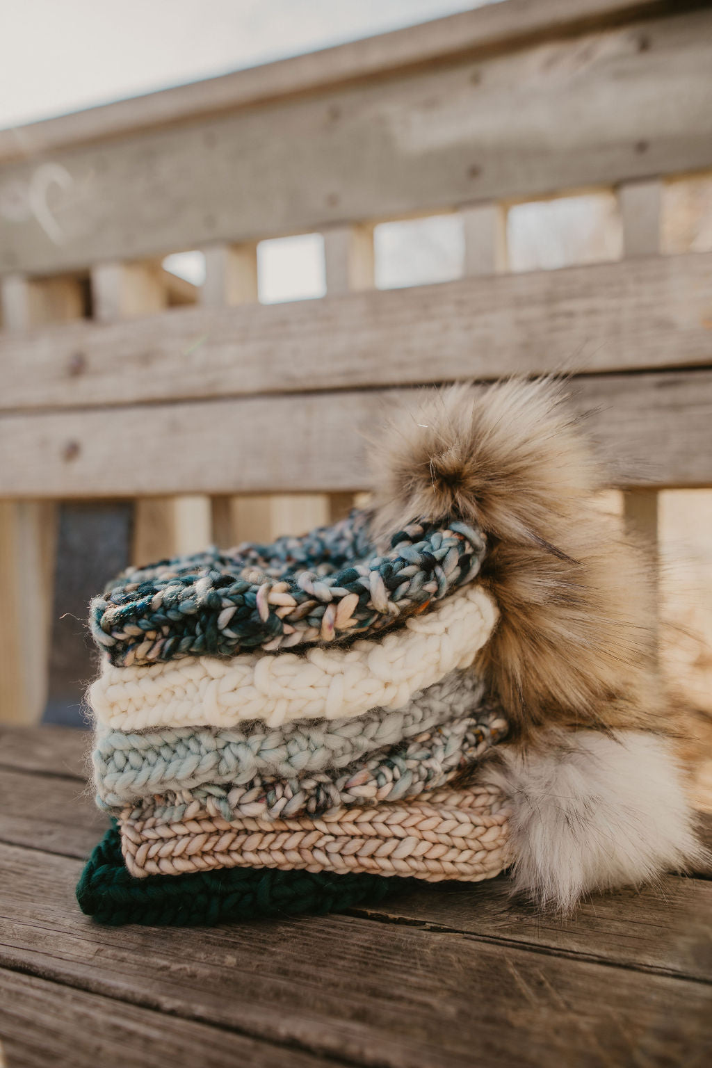 Ivory Peruvian Wool Knit Hat with faux fur pom pom by Woolly Bear Knits, showcasing soft wool and cozy design.