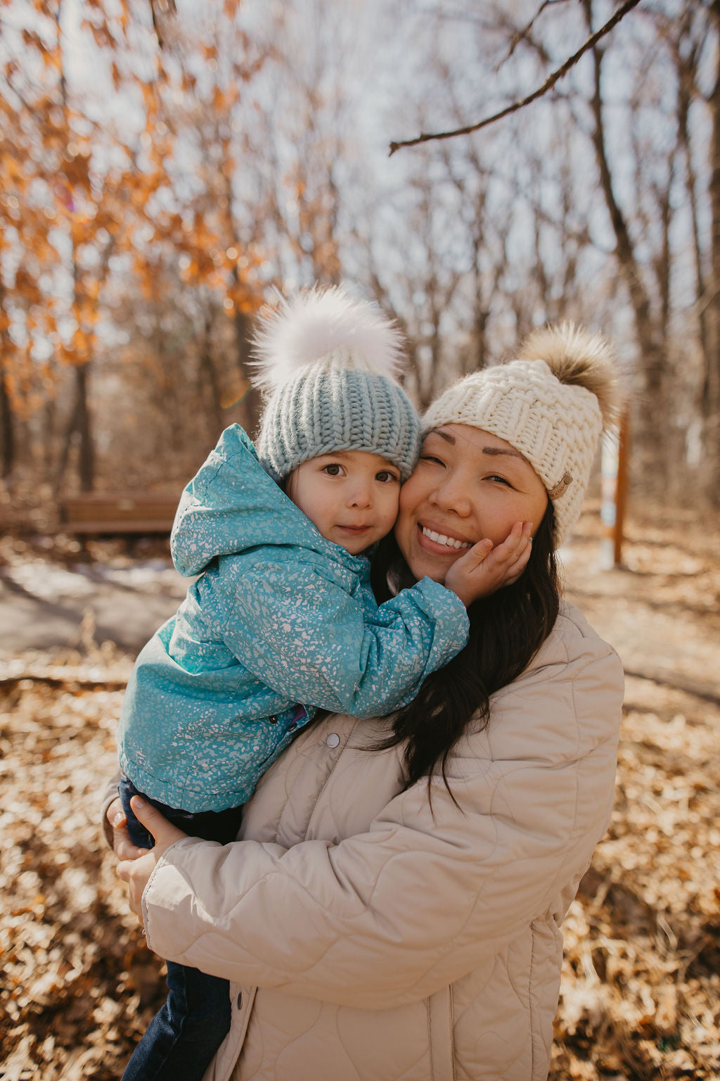 Ivory Peruvian wool knit hat by Woolly Bear Knits with a faux fur pom pom, cozy winter accessory with a warm, textured look.
