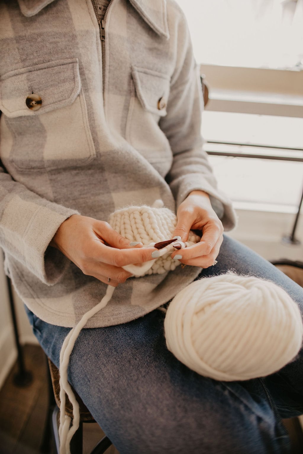 Ivory Peruvian wool knit hat by Woolly Bear Knits with faux fur pom pom, cozy winter accessory with textured knit pattern.