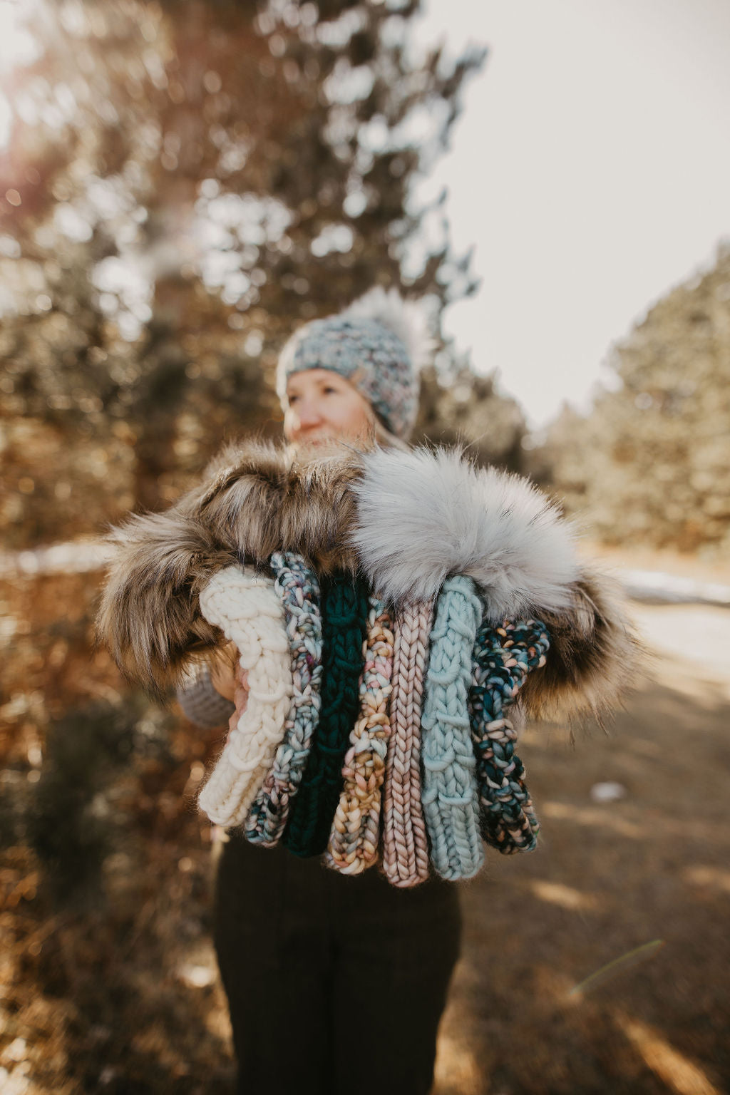 Ivory Peruvian wool knit hat with faux fur pom pom by Woolly Bear Knits, featuring a cozy, textured design for winter warmth.