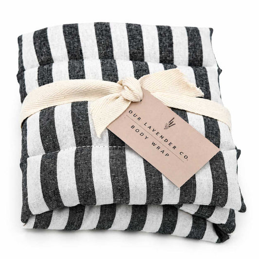Lavender body wrap heating pad from Our Lavender Co, soft fabric with lavender scent for soothing relaxation and warmth.