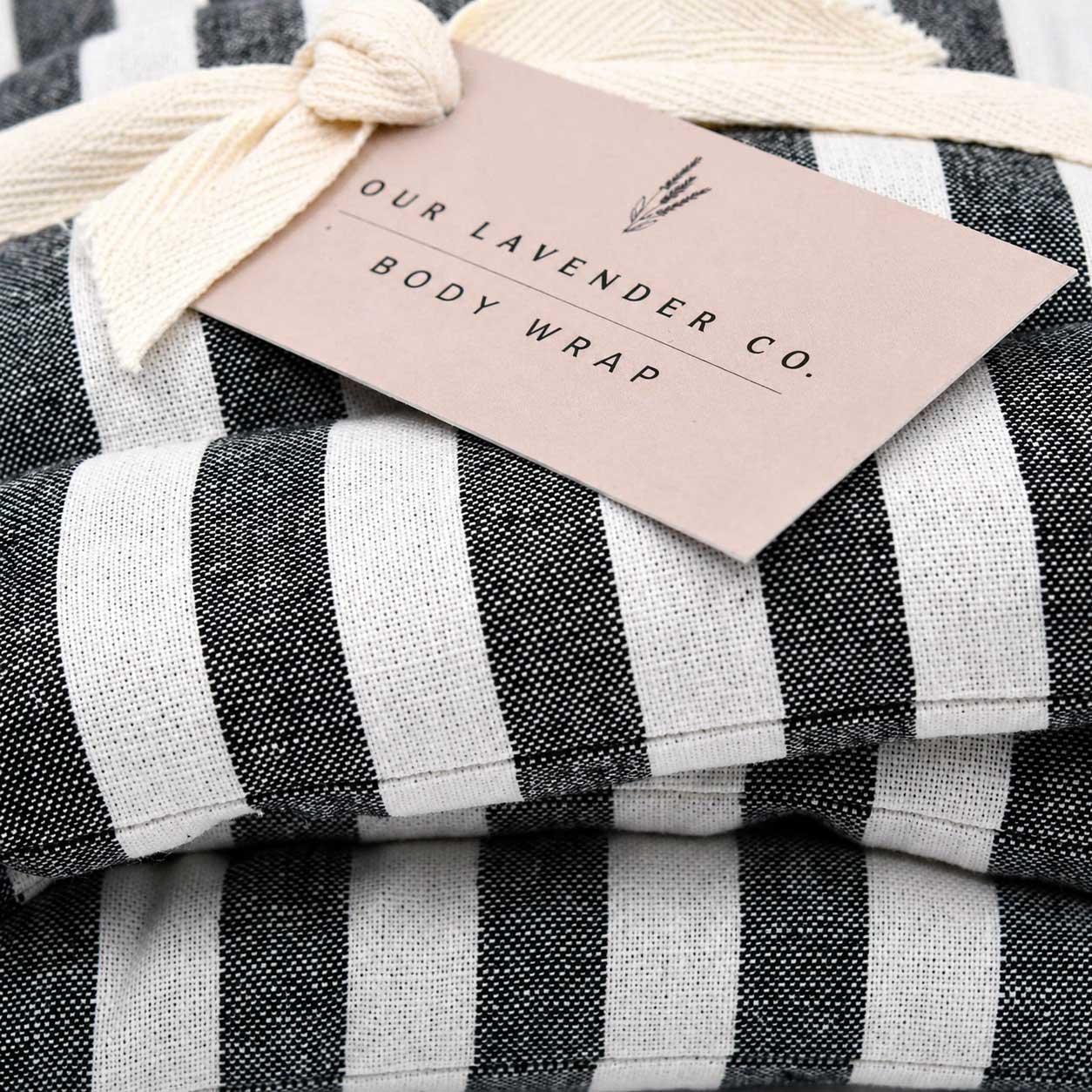 Lavender body wrap heating pad from Our Lavender Co, soft fabric wrap designed for soothing bath and body relaxation.