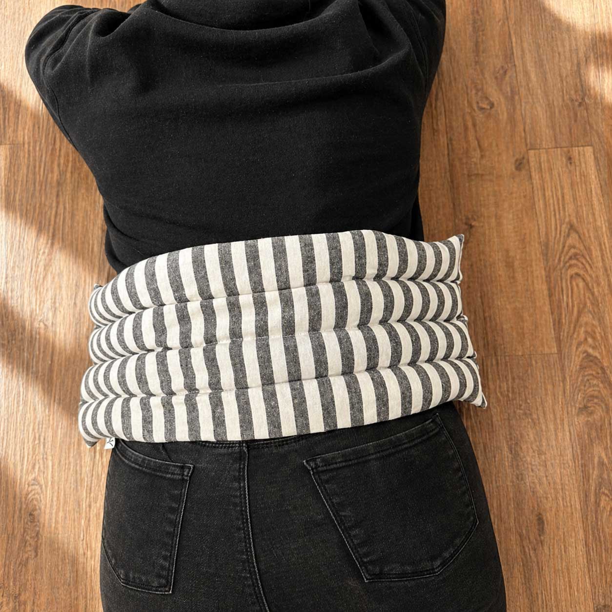 Lavender body wrap heating pad from Our Lavender Co, shown in pink with lavender scent, designed for soothing bath and body care.