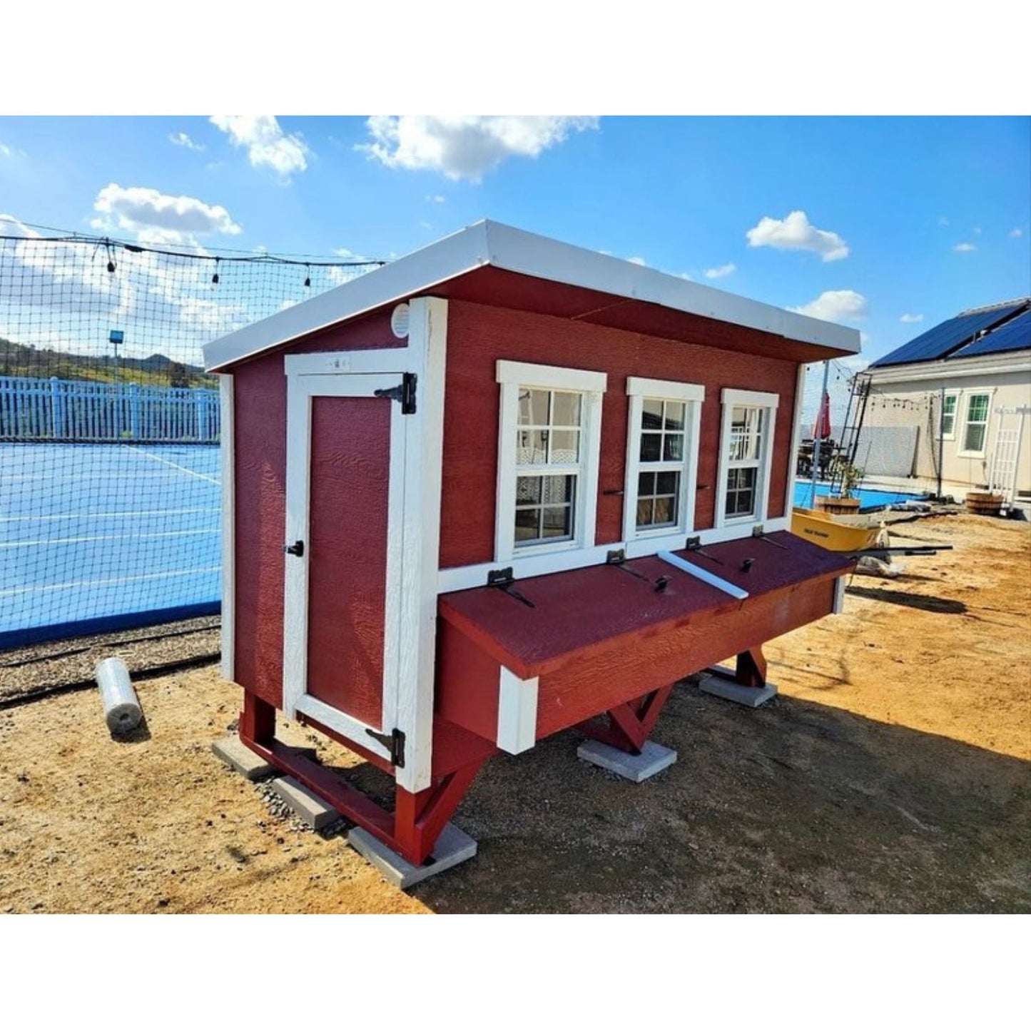 OverEZ XL chicken coop in a backyard setting, designed to house up to 20 chickens with spacious, durable construction.