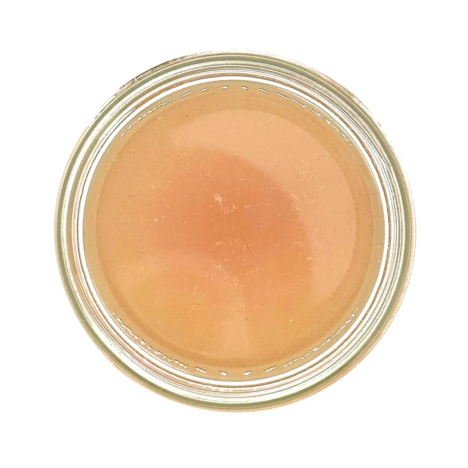 A top view of an open jar reveals Your Only Earths Rose Coconut Oil, filled with a creamy, light brown paste that resembles rich coconut oil. The jars circular rim frames the contents, which are smooth and slightly glossy.