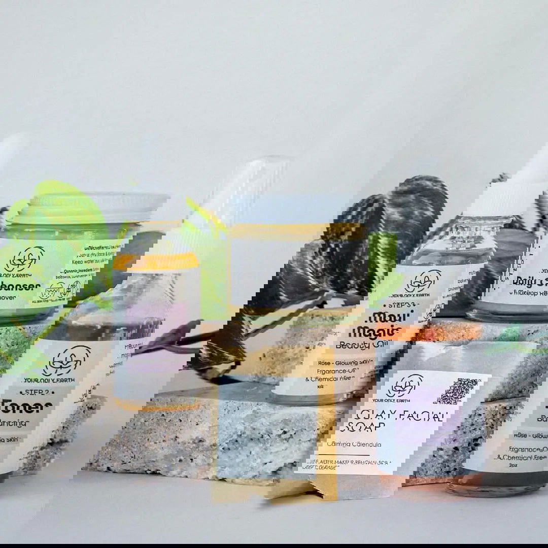 A distorted image shows several Dewy Skincare Set packages by Your Only Earth stacked on a gray stone slab, with digital glitches and diagonal lines visible against a plain background.