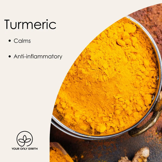 A bowl of vibrant turmeric powder sits on the surface. The text Turmeric Soap: Calms, Anti-inflammatory, Fights Dark Spots appears. A Your Only Earth logo is at the bottom, with part of the bowl playfully cropped by the design.