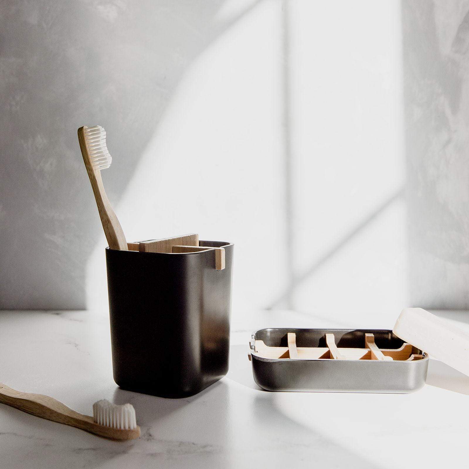 White or black bamboo fiber and corn starch Zero Waste Brush Holder for bathroom accessories, eco-friendly and stylish.