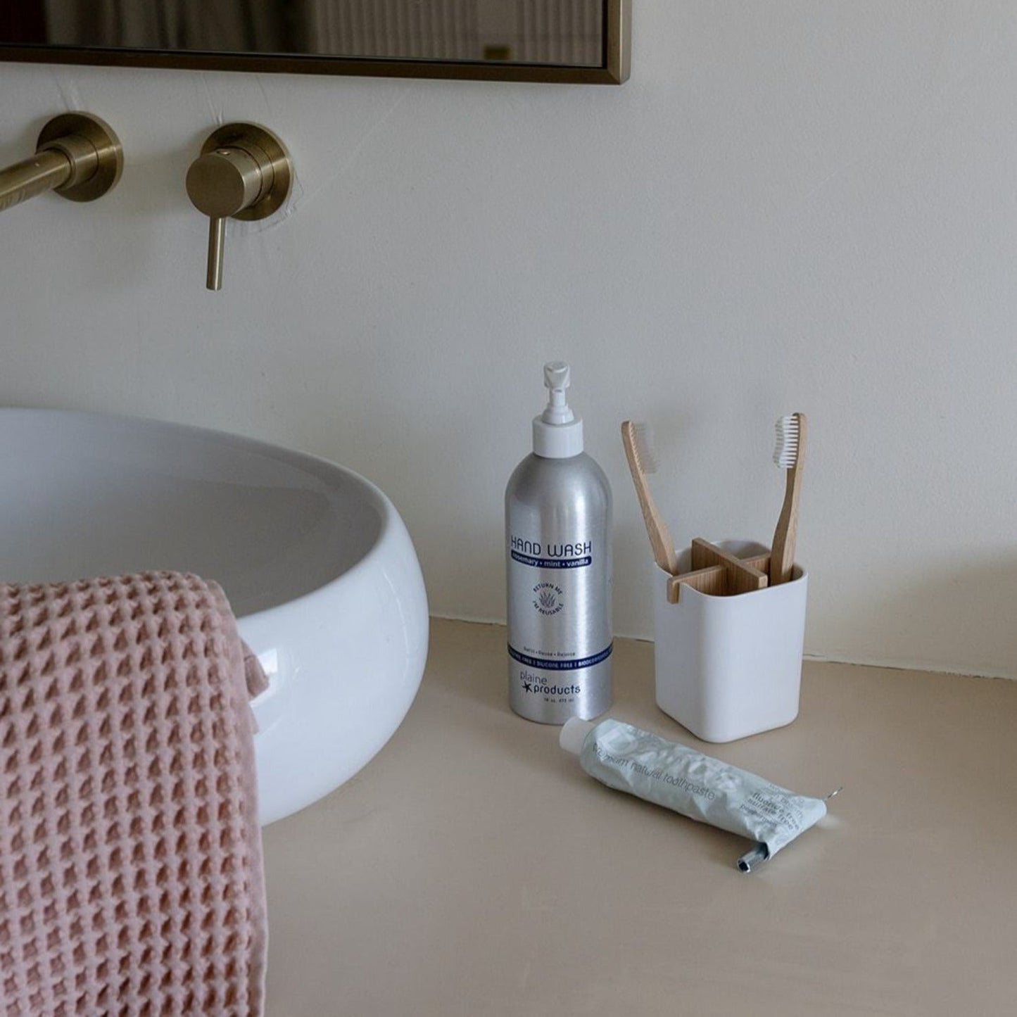 White bamboo fiber and corn starch bathroom brush holder from ZeroWasteStore.com, eco-friendly zero waste bathroom accessory.