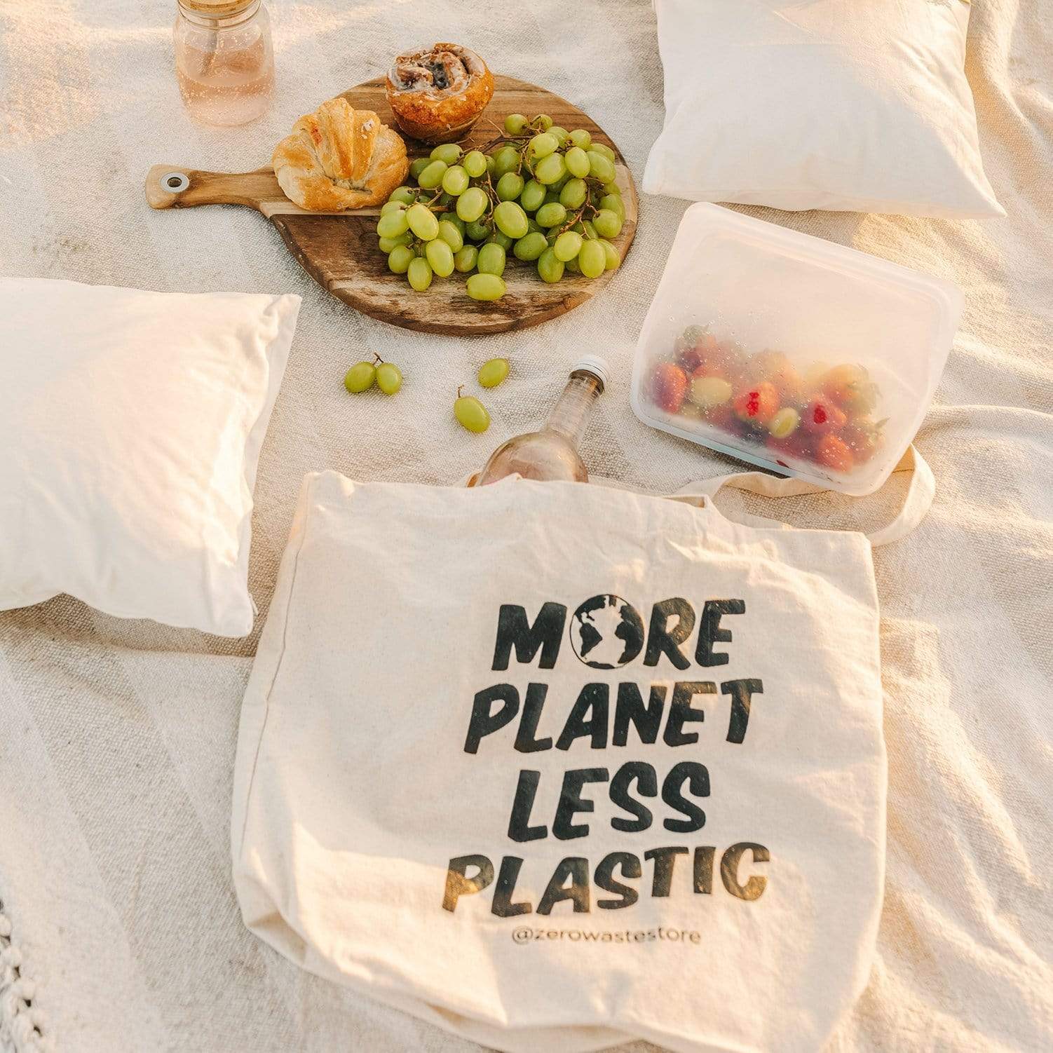 Organic tote bag by ZeroWasteStore.com with "More Planet Less Plastic" print, eco-friendly shopping tote bag made from sustainable materials.