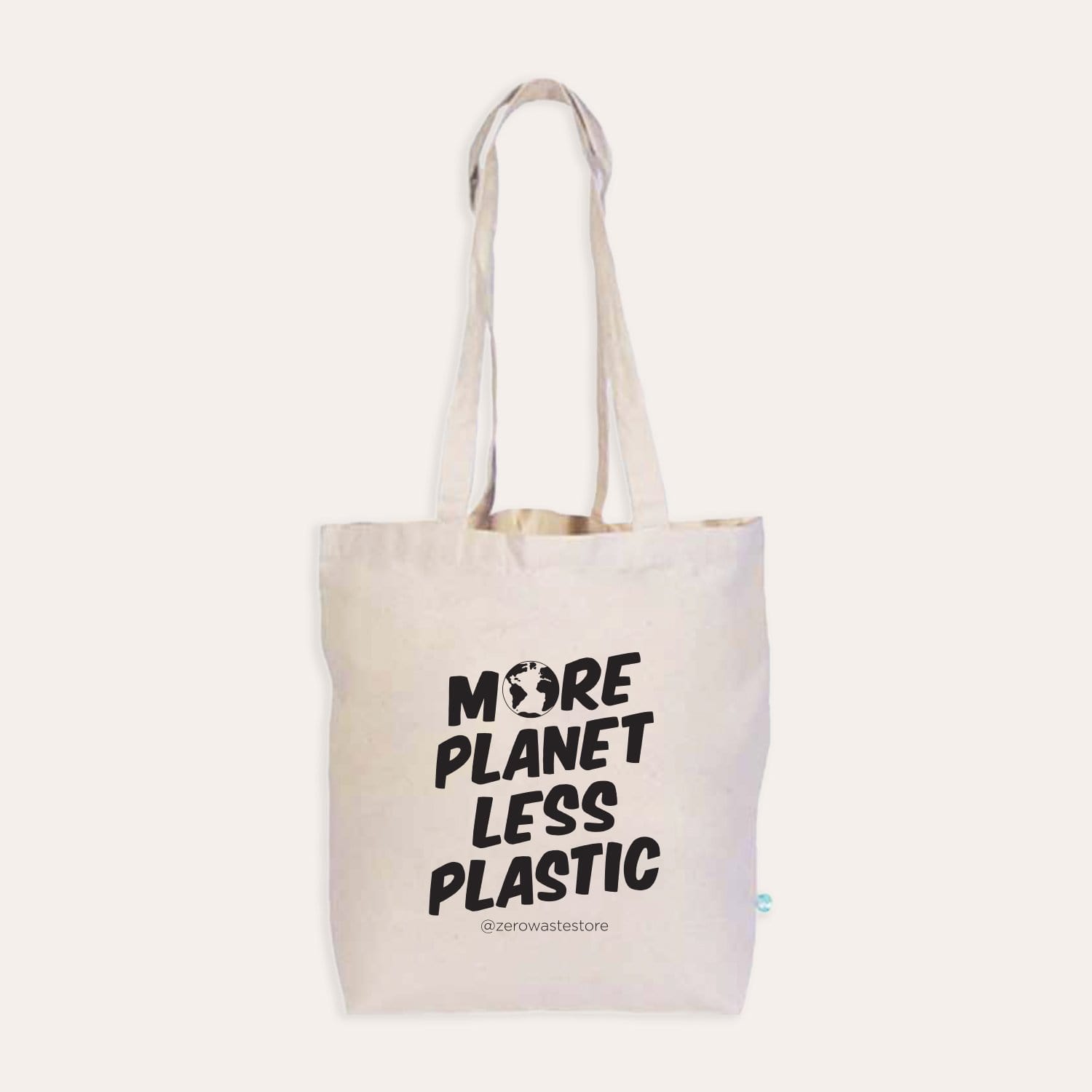 Organic tote bag from ZeroWasteStore.com with "More Planet Less Plastic" printed design, eco-friendly shopping tote bag for sustainable use.