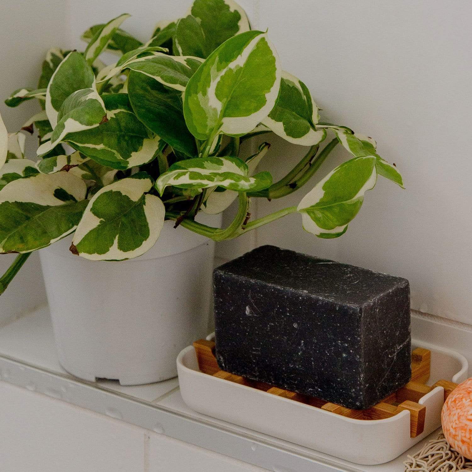 White bamboo soap dish from ZeroWasteStore.com, eco-friendly soap holder with slatted design for drainage and storage.