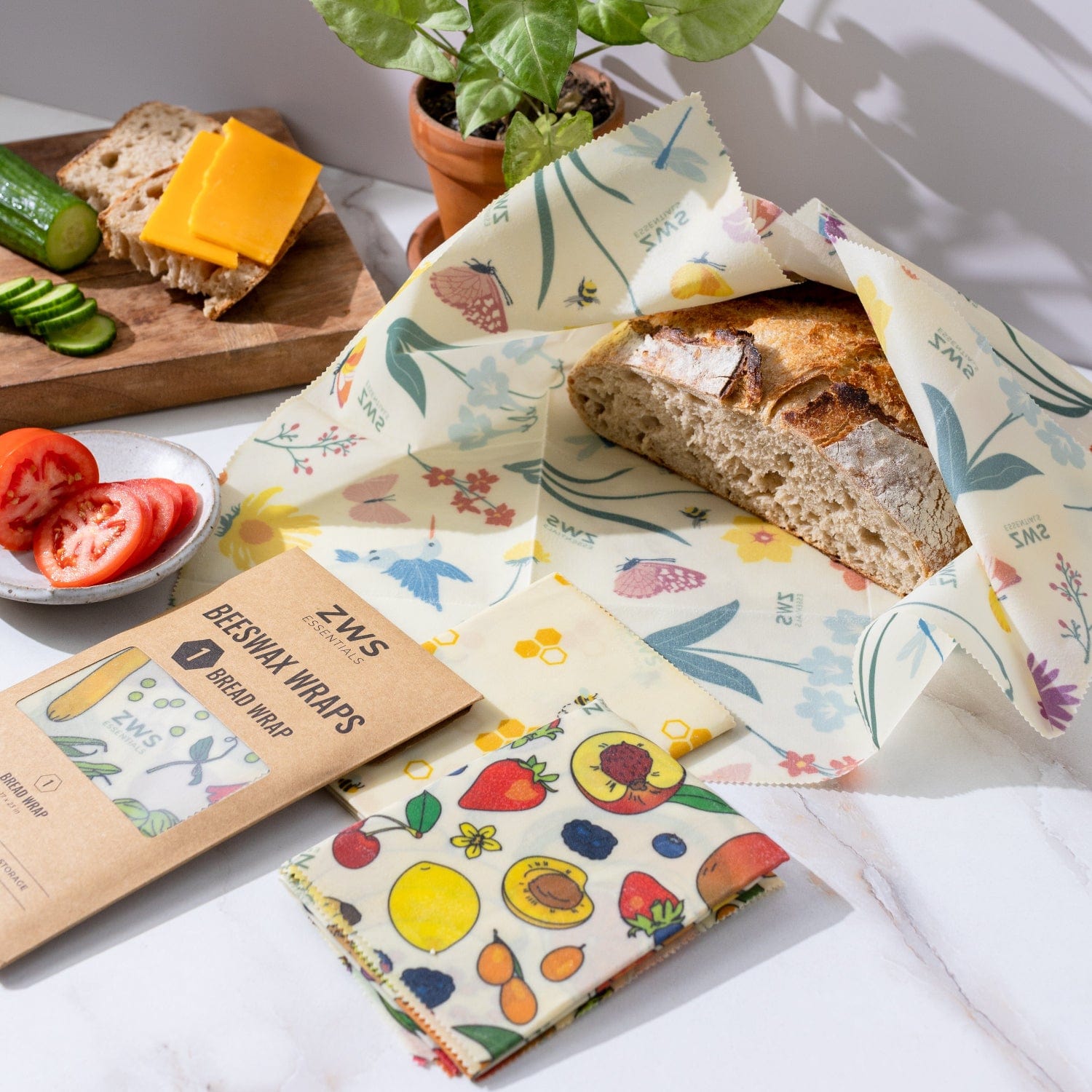 Reusable beeswax wraps for food storage, eco-friendly plastic-free food wraps by ZeroWasteStore.com, with colorful fabric patterns.