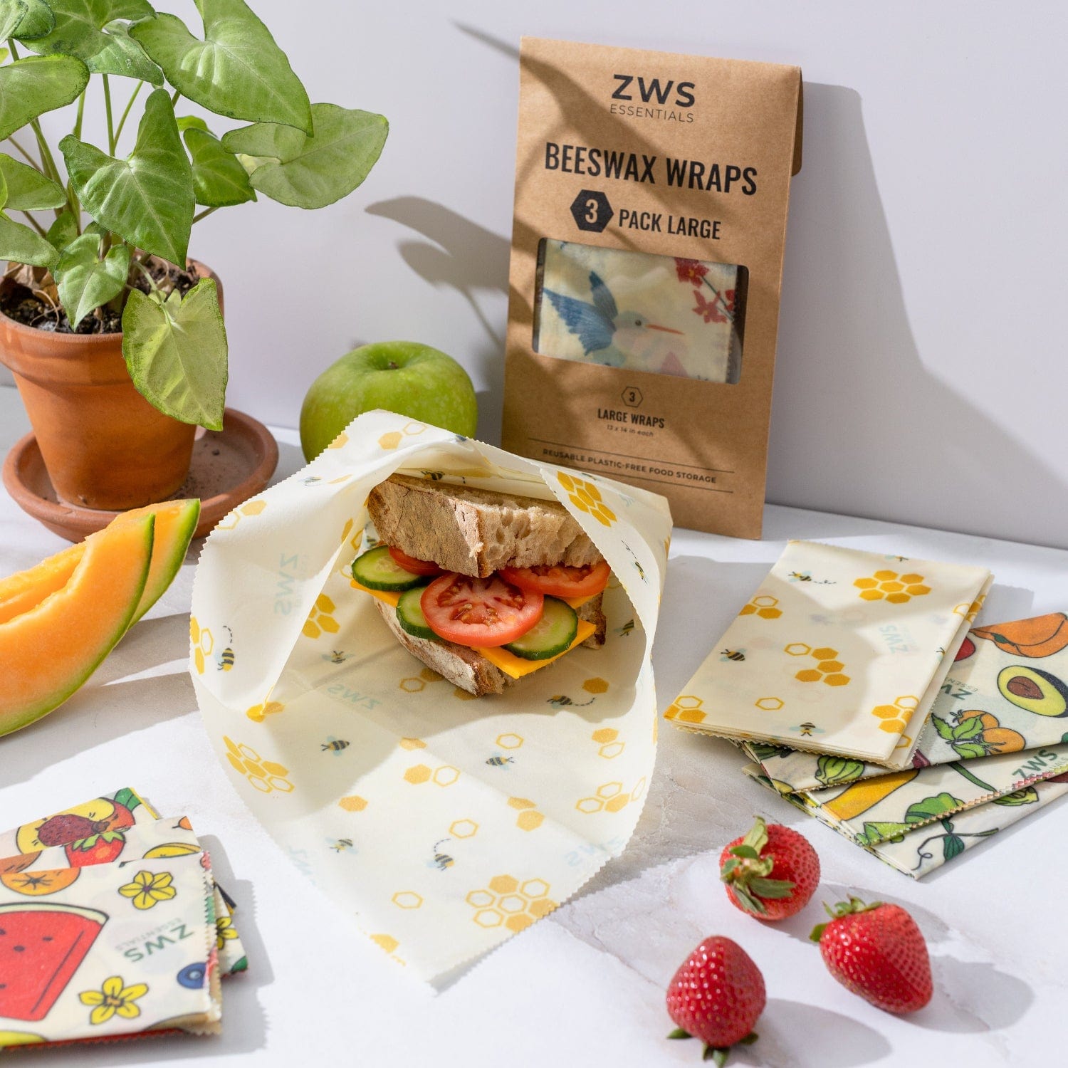 Beeswax wraps by ZeroWasteStore.com for plastic-free food storage, featuring colorful patterned fabric and beeswax coating.