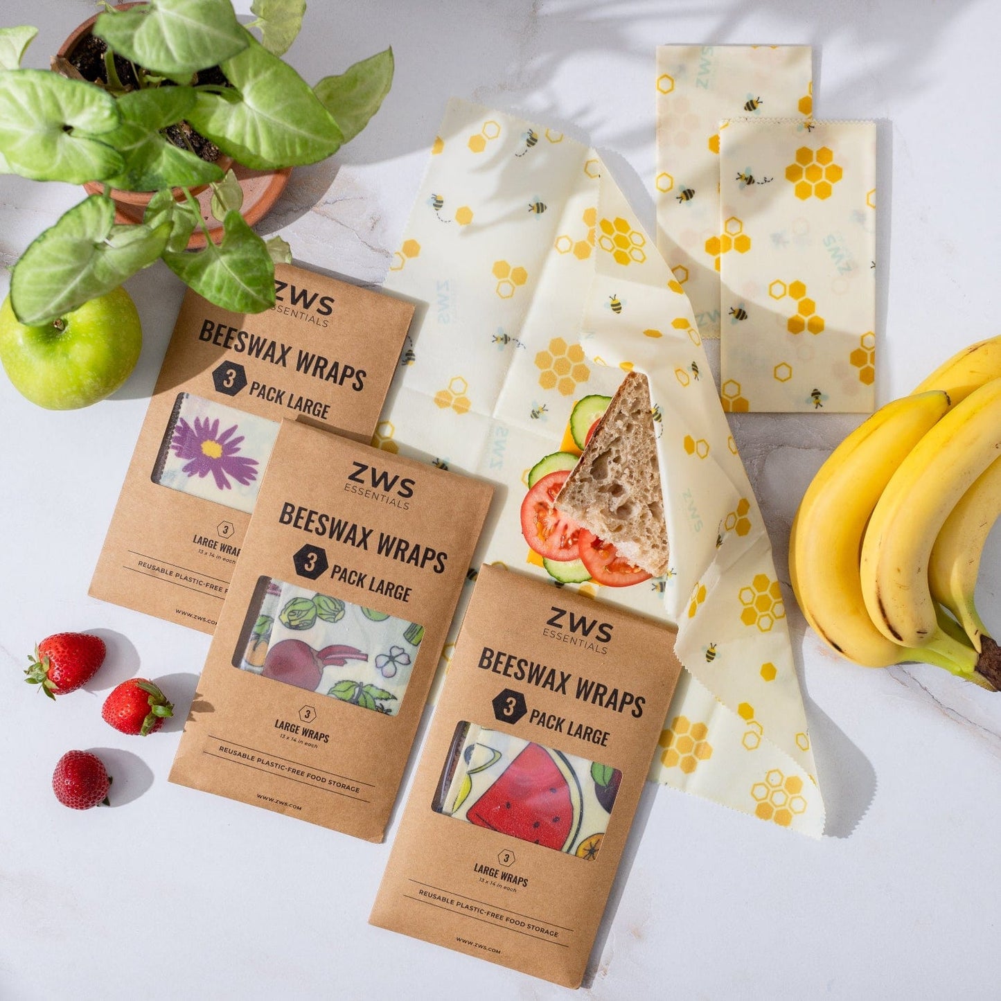 Beeswax wraps for food storage, reusable and plastic-free, with colorful patterns on natural fabric by ZeroWasteStore.com