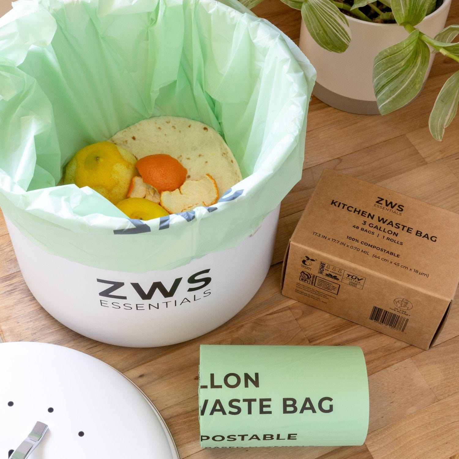 White countertop compost bin kit by ZeroWasteStore.com for kitchen composting, with a lid and removable inner container.