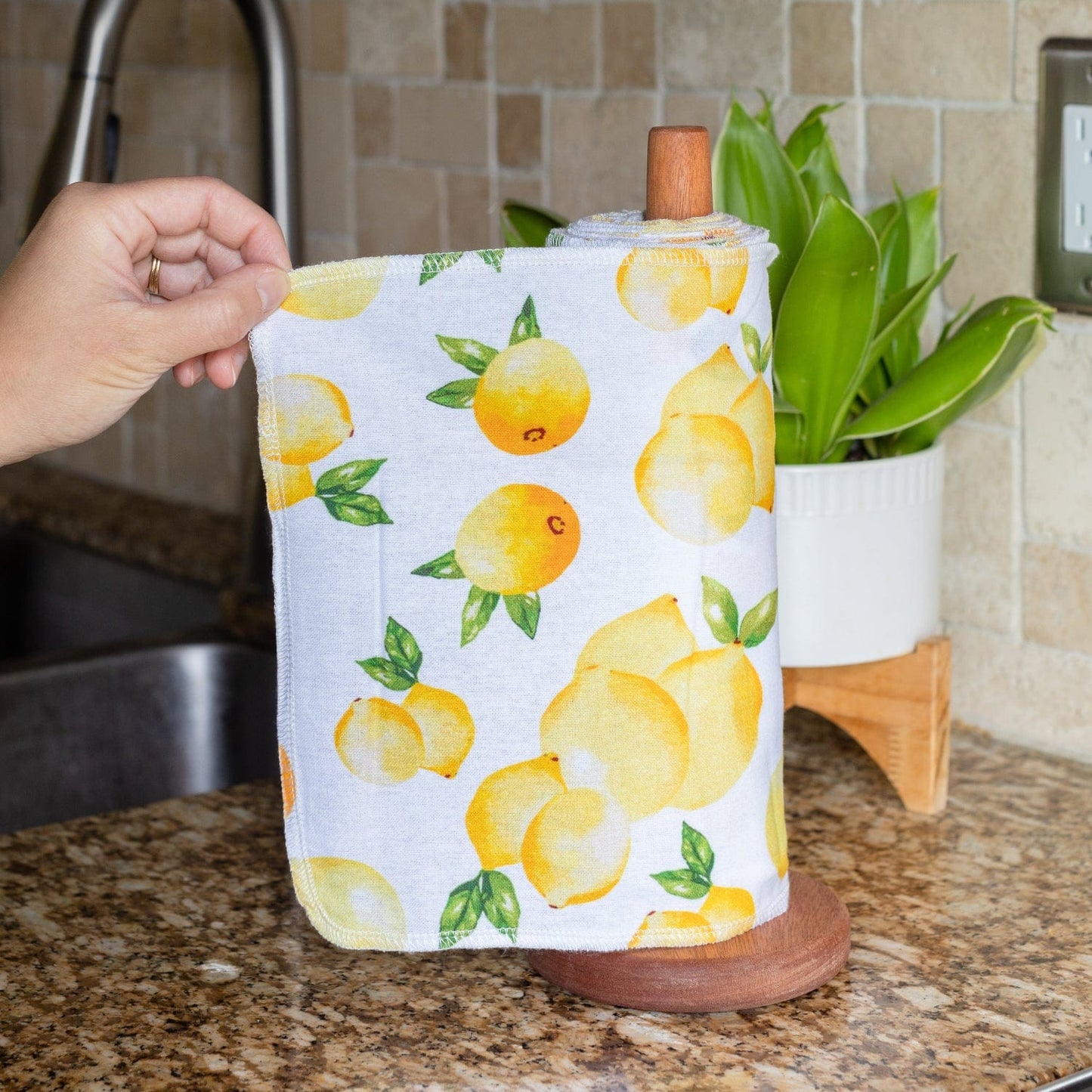 Wooden paper towel holder from ZeroWasteStore.com, featuring a natural wood finish and a sleek, functional design for kitchen use.