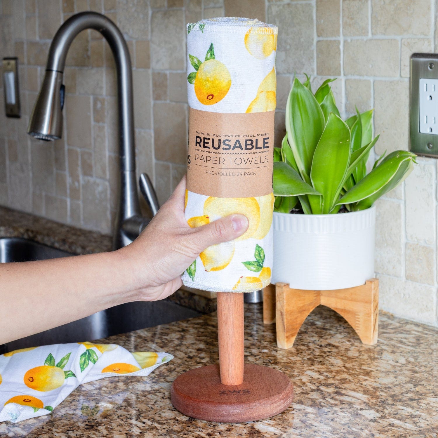 Wooden paper towel holder from ZeroWasteStore.com with a natural finish, designed to hold paper towels upright on a countertop.